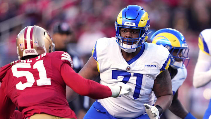 Jan 7, 2024; Santa Clara, California, USA; Los Angeles Rams offensive tackle Warren McClendon Jr. (71) blocks San Francisco 49ers defensive end Robert Beal Jr. (51) during the fourth quarter at Levi's Stadium. Mandatory Credit: Darren Yamashita-Imagn Images