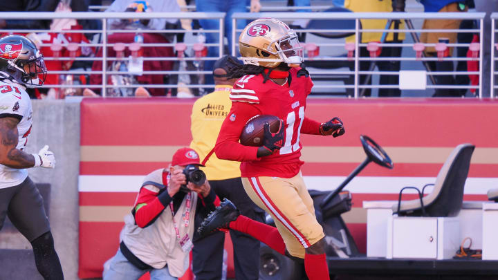 Nov 19, 2023; Santa Clara, California, USA; San Francisco 49ers wide receiver Brandon Aiyuk (11) runs after a catch for a 76-yard touchdown against the Tampa Bay Buccaneers during the third quarter at Levi's Stadium. Mandatory Credit: Kelley L Cox-USA TODAY Sports