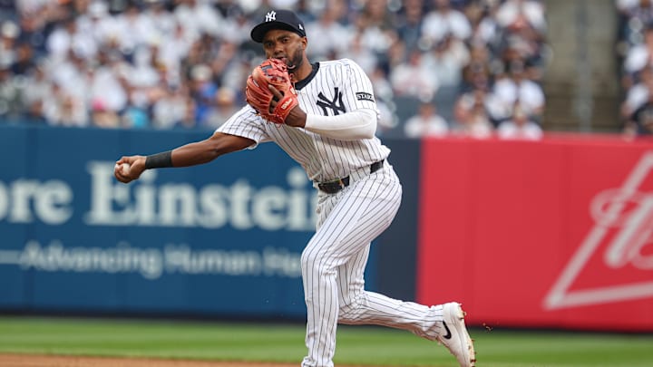 May 4, 2025; Bronx, New York, USA; New York Yankees third baseman Pablo Reyes (19) throws the ball to first base for an out during the second inning against the Tampa Bay Rays at Yankee Stadium. Mandatory Credit: Vincent Carchietta-Imagn Images