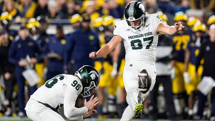 Michigan State place kicker Jonathan Kim (97) attempts a field goal against Michigan during the first half at Michigan Stadium in Ann Arbor on Saturday, Oct. 26, 2024. Michigan State place kicker Jonathan Kim (97) attempts a field goal against Michigan during the first half at Michigan Stadium in Ann Arbor on Saturday, Oct. 26, 2024.