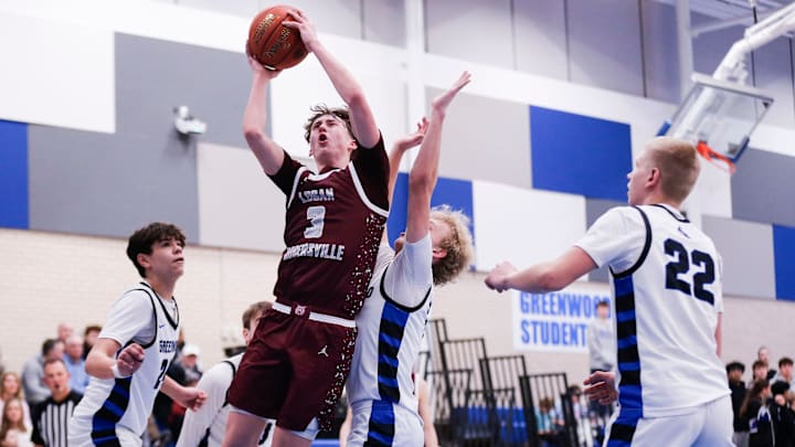Logan-Rogersville guard Chase Branham creates contact before a layup attempt during the Wildcats' win over Greenwood on Feb. 13, 2025.