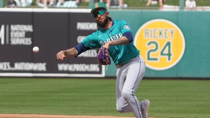 Seattle Mariners shortstop J.P. Crawford makes a throw to first base during a spring training game against the Athletics on March 17 at Hohokam Stadium.