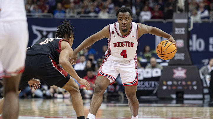 Mar 15, 2024; Kansas City, MO, USA; Houston Cougars guard LJ Cryer (4) controls the ball while defended by Texas Tech Red Raiders guard Chance McMillian (0)  in the second half at T-Mobile Center. Mandatory Credit: Amy Kontras-Imagn Images