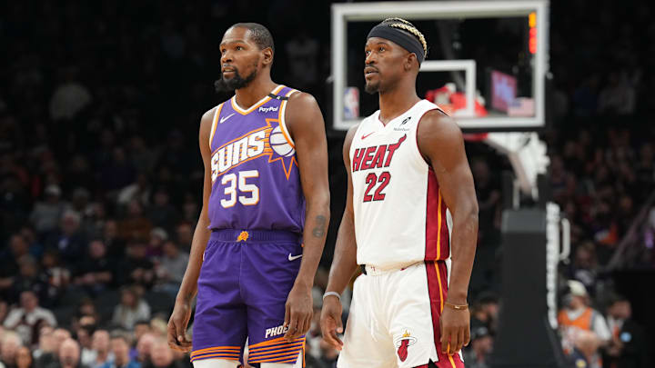 Phoenix Suns forward Kevin Durant (35) and Miami Heat forward Jimmy Butler (22) look on during the first half at Footprint Center. Phoenix Suns forward Kevin Durant (35) and Miami Heat forward Jimmy Butler (22) look on during the first half at Footprint Center.
