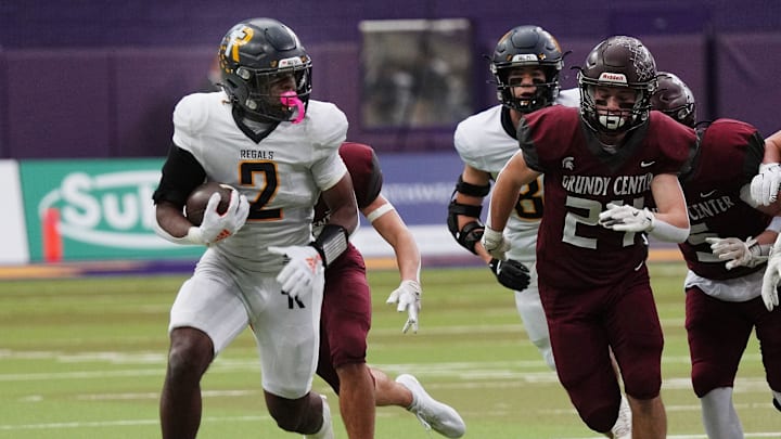 Regina's running back Savion Miller (2) runs with the ball for a first down against Grundy Center during the first quarter in the 1A High School state semi-final on Nov. 14, 2025, at UNI-Dome in Cedar Falls, Iowa.