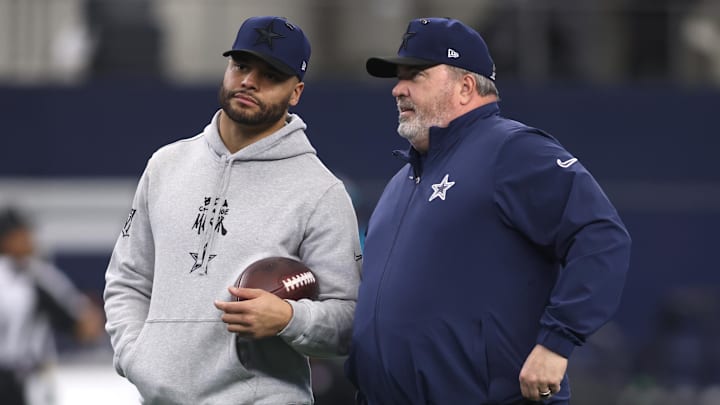 Jan 5, 2025; Arlington, Texas, USA; Dallas Cowboys quarterback Dak Prescott (4) talks to head coach Mike McCarthy before the game against the Washington Commanders at AT&T Stadium. Mandatory Credit: Tim Heitman-Imagn Images