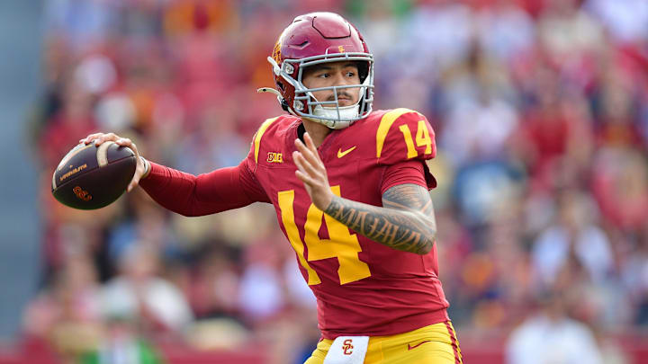 Nov 30, 2024; Los Angeles, California, USA; Southern California Trojans quarterback Jayden Maiava (14) throws against the Notre Dame Fighting Irish during the first half at the Los Angeles Memorial Coliseum. Mandatory Credit: Gary A. Vasquez-Imagn Images Nov 30, 2024; Los Angeles, California, USA; Southern California Trojans quarterback Jayden Maiava (14) throws against the Notre Dame Fighting Irish during the first half at the Los Angeles Memorial Coliseum. Mandatory Credit: Gary A. Vasquez-Imagn Images