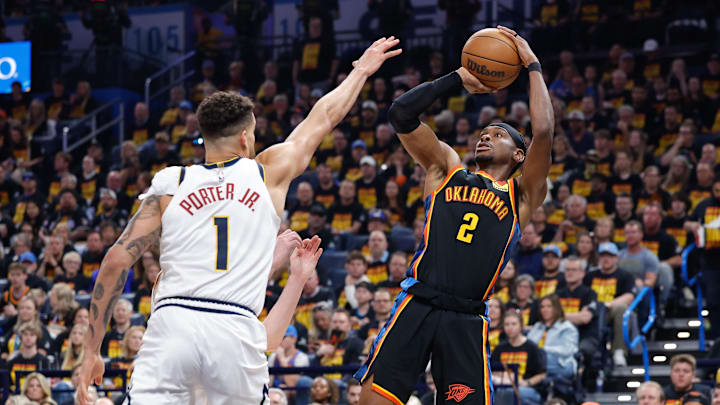 May 5, 2025; Oklahoma City, Oklahoma, USA; Oklahoma City Thunder guard Shai Gilgeous-Alexander (2) shoots as Denver Nuggets forward Michael Porter Jr. (1) defends during the second half during game one of the second round for the 2025 NBA Playoffs at Paycom Center. Mandatory Credit: Alonzo Adams-Imagn Images May 5, 2025; Oklahoma City, Oklahoma, USA; Oklahoma City Thunder guard Shai Gilgeous-Alexander (2) shoots as Denver Nuggets forward Michael Porter Jr. (1) defends during the second half during game one of the second round for the 2025 NBA Playoffs at Paycom Center. Mandatory Credit: Alonzo Adams-Imagn Images