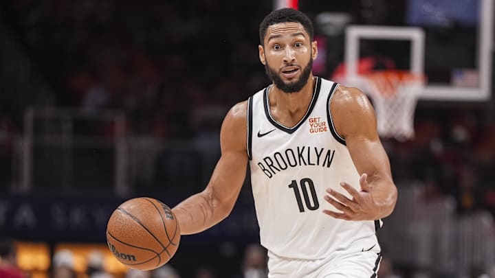 Brooklyn Nets guard Ben Simmons (10) directs teammates while controlling the ball during the first half at State Farm Arena. Mandatory Credit: Dale Zanine-Imagn Images