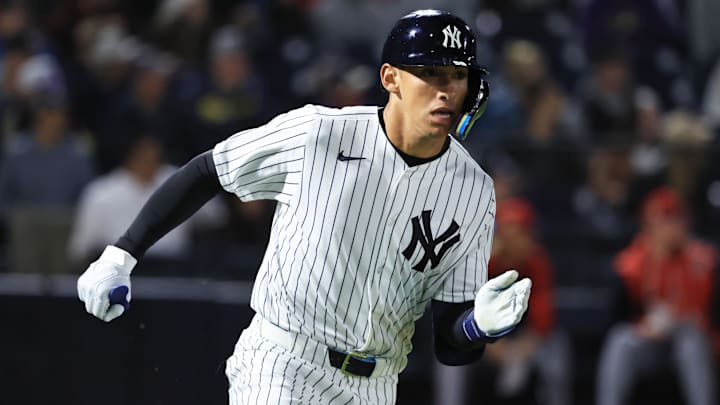 Feb 25, 2026; Tampa, Florida, USA; New York Yankees infielder George Lombard Jr (96) hits a two-RBI double during the fifth inning against the Washington Nationals at George M. Steinbrenner Field. Mandatory Credit: Kim Klement Neitzel-Imagn Images