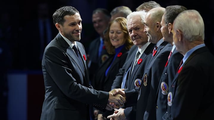 Nov 8, 2024; Toronto, Ontario, CAN; Class of 2024 Hockey Hall of Fame inductee Pavel Datsyuk (left) is greeted by Hockey Hall of Fame members before a game against between the Detroit Red Wings and Toronto Maple Leafs during the first period at Scotiabank Arena. Mandatory Credit: John E. Sokolowski-Imagn Images