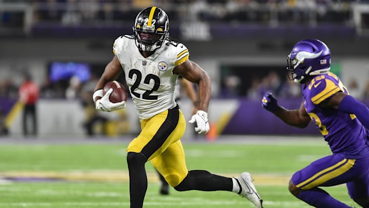 Dec 9, 2021; Minneapolis, Minnesota, USA; Pittsburgh Steelers running back Najee Harris (22) runs with the ball as Minnesota Vikings free safety Xavier Woods (23) chases during the third quarter at U.S. Bank Stadium.