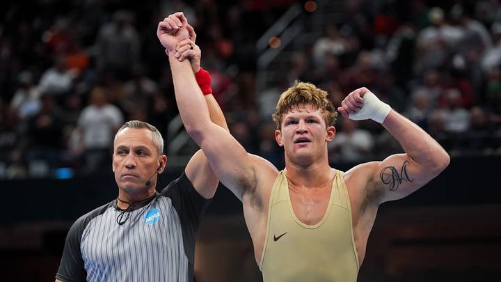 Mar 21, 2026; Cleveland, OH, USA;  Minnesota Golden Gophers Max McEnelly reacts to defeating Penn State Nittany Lions Rocco Welsh during the NCAA DI Wrestling Championship at Rocket Arena. Mandatory Credit: Aaron Doster-Imagn Images