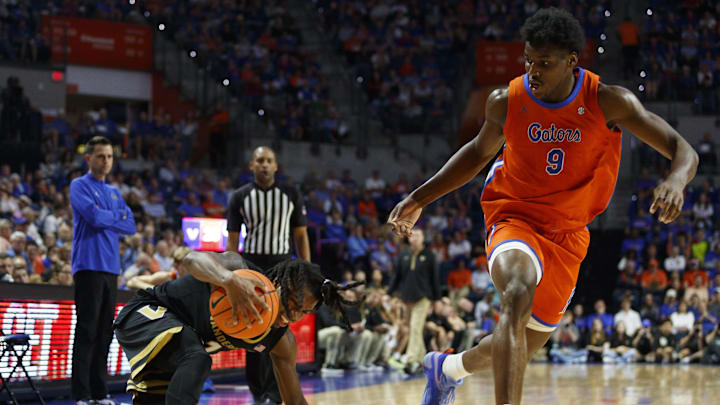 oFeb 4, 2025; Gainesville, Florida, USA; Vanderbilt Commodores guard Jason Edwards (1) slips on the court next to Florida Gators center Rueben Chinyelu (9) during the first half at Exactech Arena at the Stephen C. O'Connell Center. Mandatory Credit: Morgan Tencza-Imagn Images oFeb 4, 2025; Gainesville, Florida, USA; Vanderbilt Commodores guard Jason Edwards (1) slips on the court next to Florida Gators center Rueben Chinyelu (9) during the first half at Exactech Arena at the Stephen C. O'Connell Center. Mandatory Credit: Morgan Tencza-Imagn Images
