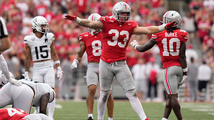 Aug 31, 2024; Columbus, OH, USA; Ohio State Buckeyes defensive end Jack Sawyer (33) reacts to a hit during the second half of the NCAA football game against the Akron Zips at Ohio Stadium. Ohio State won 52-6.