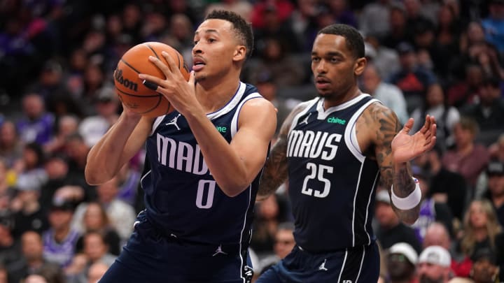 Mar 29, 2024; Sacramento, California, USA; Dallas Mavericks guard Dante Exum (0) holds onto a Mar 29, 2024; Sacramento, California, USA; Dallas Mavericks guard Dante Exum (0) holds onto a