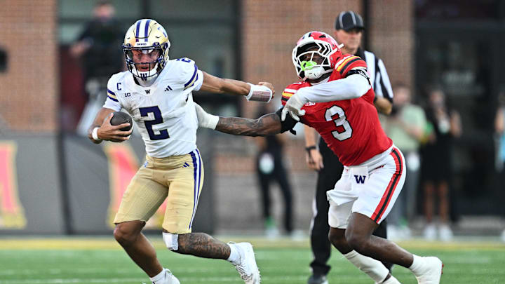 Oct 4, 2025; College Park, Maryland, USA; Washington Huskies quarterback Demond Williams Jr. (2) eludes the grasp of Maryland Terrapins linebacker Trey Reddick (3) in the second half at SECU Stadium. Mandatory Credit: Jamie Sabau-Imagn Images Oct 4, 2025; College Park, Maryland, USA; Washington Huskies quarterback Demond Williams Jr. (2) eludes the grasp of Maryland Terrapins linebacker Trey Reddick (3) in the second half at SECU Stadium. Mandatory Credit: Jamie Sabau-Imagn Images