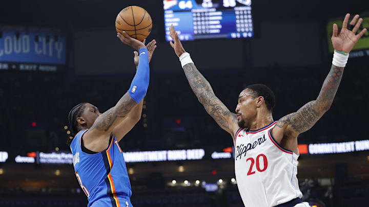 Dec 18, 2025; Oklahoma City, Oklahoma, USA; Oklahoma City Thunder guard Jalen Williams (8) shoots as Los Angeles Clippers forward John Collins (20) defends during the second quarter at Paycom Center. Mandatory Credit: Alonzo Adams-Imagn Images