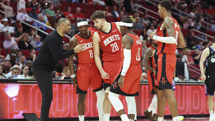 Apr 2, 2025; Houston, Texas, USA; Houston Rockets head coach Ime Udoka talks with players during the fourth quarter against the Utah Jazz at Toyota Center. Mandatory Credit: Troy Taormina-Imagn Images