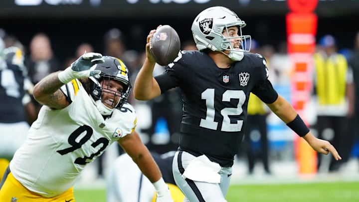 Oct 13, 2024; Paradise, Nevada, USA; Las Vegas Raiders quarterback Aidan O'Connell (12) is flushed from the pocket by Pittsburgh Steelers defensive tackle Isaiahh Loudermilk (92) during the second quarter at Allegiant Stadium. Mandatory Credit: Stephen R. Sylvanie-Imagn Images Oct 13, 2024; Paradise, Nevada, USA; Las Vegas Raiders quarterback Aidan O'Connell (12) is flushed from the pocket by Pittsburgh Steelers defensive tackle Isaiahh Loudermilk (92) during the second quarter at Allegiant Stadium. Mandatory Credit: Stephen R. Sylvanie-Imagn Images