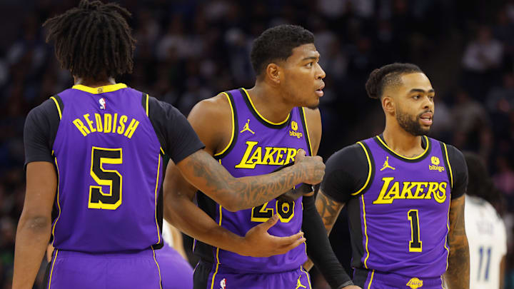 Dec 30, 2023; Minneapolis, Minnesota, USA; Los Angeles Lakers forward Rui Hachimura (28) reacts to his technical foul as he stands between forward Cam Reddish (5) and guard D'Angelo Russell (1) in the first quarter of the game with the Minnesota Timberwolves at Target Center. Mandatory Credit: Bruce Kluckhohn-Imagn Images Dec 30, 2023; Minneapolis, Minnesota, USA; Los Angeles Lakers forward Rui Hachimura (28) reacts to his technical foul as he stands between forward Cam Reddish (5) and guard D'Angelo Russell (1) in the first quarter of the game with the Minnesota Timberwolves at Target Center. Mandatory Credit: Bruce Kluckhohn-Imagn Images