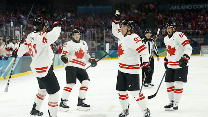 Feb 12, 2026; Milan, Italy; Mark Stone of Canada celebrates scoring their second goal with Mitch Marner of Canada against Czechia in a men's ice hockey group A match during the Milano Cortina 2026 Olympic Winter Games at Milano Santagiulia Ice Hockey Arena. Mandatory Credit: Geoff Burke-Imagn Images