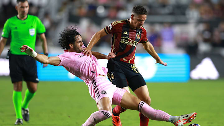 Inter Miami's Leonardo Campana goes in for a slide tackle on Atlanta United's Osvaldo Alonso.