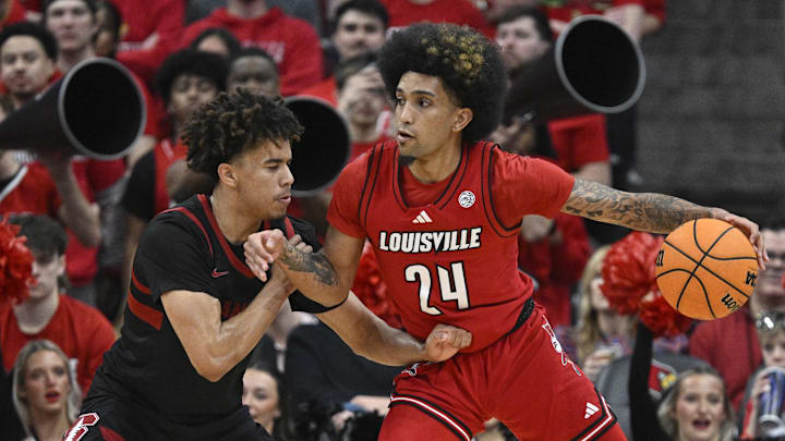 Mar 8, 2025; Louisville, Kentucky, USA; Louisville Cardinals guard Chucky Hepburn (24) dribbles against Stanford Cardinal guard Oziyah Sellers (4) during the first half at KFC Yum! Center. Louisville defeated Stanford 68-48. Mandatory Credit: Jamie Rhodes-Imagn Images Mar 8, 2025; Louisville, Kentucky, USA; Louisville Cardinals guard Chucky Hepburn (24) dribbles against Stanford Cardinal guard Oziyah Sellers (4) during the first half at KFC Yum! Center. Louisville defeated Stanford 68-48. Mandatory Credit: Jamie Rhodes-Imagn Images