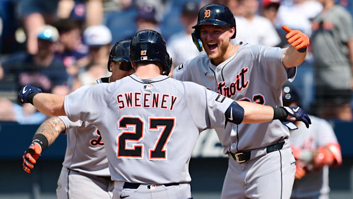 Jul 6, 2025; Cleveland, Ohio, USA; Detroit Tigers shortstop Trey Sweeney (27) celebrates with Javier Baez third baseman (28) and center fielder Parker Meadows (22) after hitting a home run during the tenth inning against the Cleveland Guardians at Progressive Field.