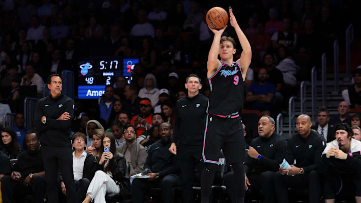 Mar 30, 2026; Miami, Florida, USA; Miami Heat guard Pelle Larsson (9) shoots the basketball against the Philadelphia 76ers during the second quarter at Kaseya Center. Mandatory Credit: Sam Navarro-Imagn Images