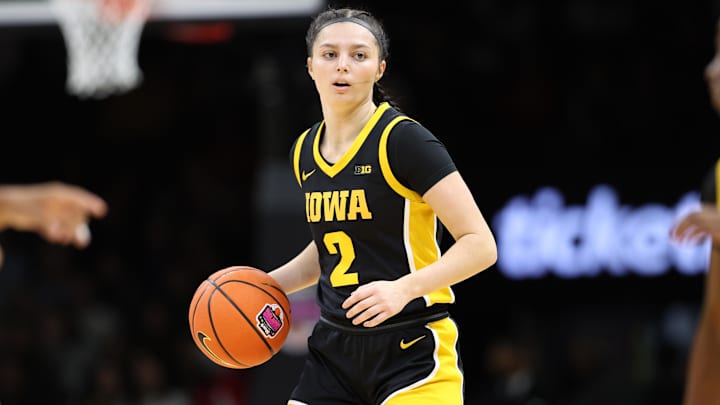 Dec 20, 2025; Brooklyn, New York, USA; Iowa Hawkeyes guard Taylor McCabe (2) dribbles the ball against the UConn Huskies during the first half at Barclays Center. Mandatory Credit: Pamela Smith-Imagn Images