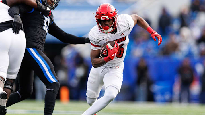 Nov 30, 2024; Lexington, Kentucky, USA; Louisville Cardinals running back Duke Watson (26) runs the ball during the third quarter against the Kentucky Wildcats at Kroger Field. Mandatory Credit: Jordan Prather-Imagn Images