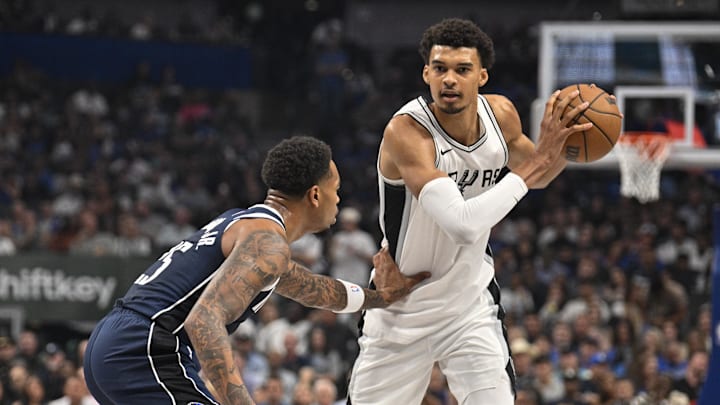 Oct 24, 2024; Dallas, Texas, USA; Dallas Mavericks forward P.J. Washington (25) and San Antonio Spurs center Victor Wembanyama (1) in action during the game between the Dallas Mavericks and the San Antonio Spurs at the American Airlines Center. Mandatory Credit: Jerome Miron-Imagn Images Oct 24, 2024; Dallas, Texas, USA; Dallas Mavericks forward P.J. Washington (25) and San Antonio Spurs center Victor Wembanyama (1) in action during the game between the Dallas Mavericks and the San Antonio Spurs at the American Airlines Center. Mandatory Credit: Jerome Miron-Imagn Images