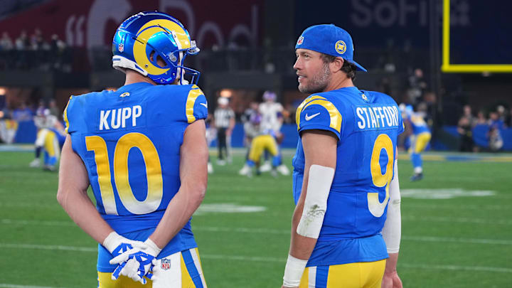 Los Angeles Rams quarterback Matthew Stafford (9) and wide receiver Cooper Kupp (10) watch from the sidelines against the Minnesota Vikings during the second half in an NFC wild card game at State Farm Stadium.