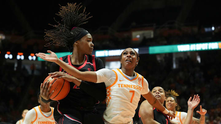 Georgia's Fatima Diakhate (21) gets the rebound over Tennessee's Samara Spencer (7) in an NCAA college basketball game on Sunday, March 2, 2025, in Knoxville, Tenn.