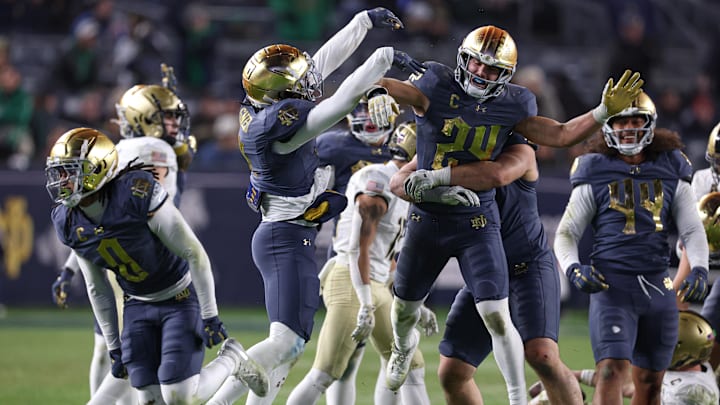 Nov 23, 2024; New York, New York, USA; Notre Dame Fighting Irish linebacker Jack Kiser (24) celebrates with teammates after a defensive stop during the second half against the Army Black Knights at Yankee Stadium. 