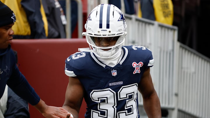 Dallas Cowboys running back Javonte Williams runs onto the field for warmups before a game against the Washington Commanders