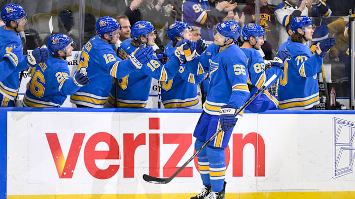 Mar 1, 2025; St. Louis, Missouri, USA;  St. Louis Blues defenseman Colton Parayko (55) is congratulated by teammates after scoring against the Los Angeles Kings during the first period at Enterprise Center. Mandatory Credit: Jeff Curry-Imagn Images