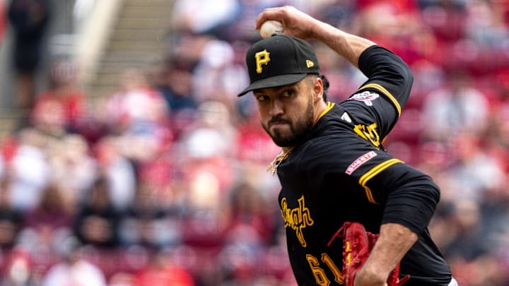 Pittsburgh Pirates pitcher Justin Lawrence (61) throws a pitch in the sixth inning of the MLB game between the Cincinnati Reds and the Pittsburgh Pirates at Great American Ball Park in Cincinnati on Sunday, April 13, 2025.