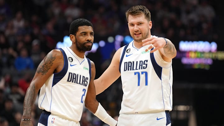 Feb 11, 2023; Sacramento, California, USA; Dallas Mavericks guard Kyrie Irving (2) and guard Luka Doncic (77) talk during the first quarter against the Sacramento Kings at Golden 1 Center. Mandatory Credit: Darren Yamashita-Imagn Images