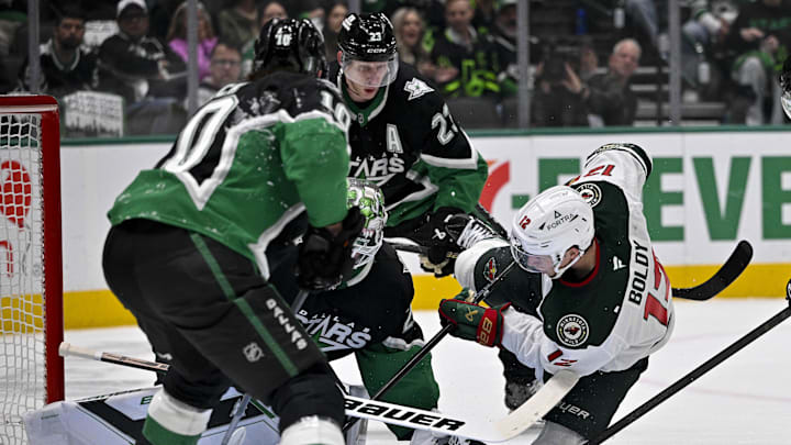 Apr 28, 2026; Dallas, Texas, USA; Minnesota Wild left wing Matt Boldy (12) scores a power play goal against Dallas Stars goaltender Jake Oettinger (29) during the first period in game five of the first round of the 2026 Stanley Cup Playoffs at American Airlines Center. The Stars challenge for goaltender interference and the goal is waved off by the referees. Mandatory Credit: Jerome Miron-Imagn Images