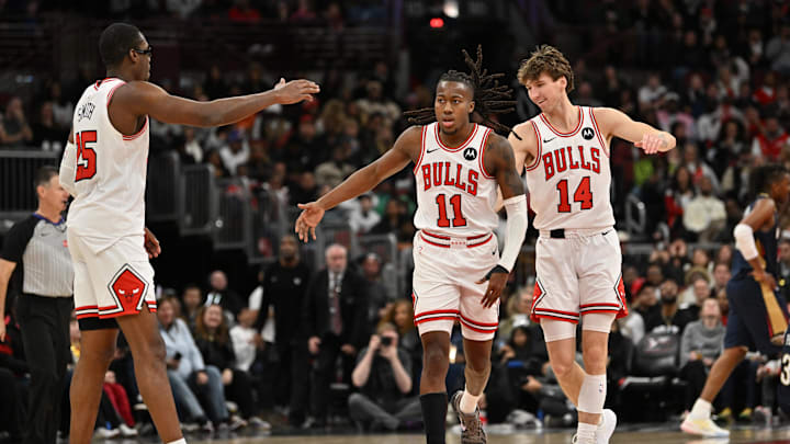 Dec 31, 2025; Chicago, Illinois, USA; Chicago Bulls guard Ayo Dosunmu (11) celebrates his three point shot with forward Jalen Smith (25) and forward Matas Buzelis (14) against the New Orleans Pelicans during the second half at United Center. Mandatory Credit: Patrick Gorski-Imagn Images
