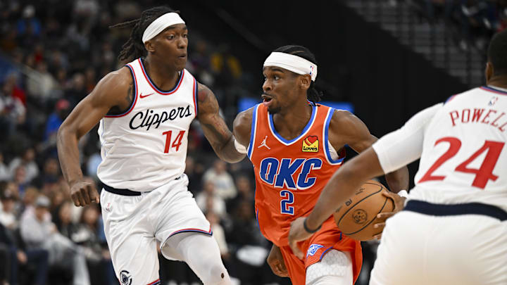 Nov 2, 2024; Inglewood, California, USA; Oklahoma City Thunder guard Shai Gilgeous-Alexander (2) drives the ball against LA Clippers guard Terance Mann (14) during the second half at Intuit Dome. Mandatory Credit: Jonathan Hui-Imagn Images