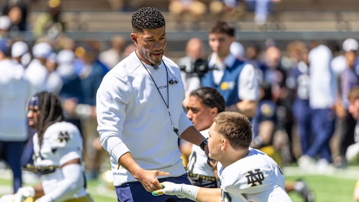 Apr 25, 2026; Notre Dame, IN, USA; Notre Dame Fighting Irish head coach Marcus Freeman greets players before the Blue-Gold game at Notre Dame Stadium. 