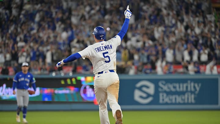 Oct 27, 2025; Los Angeles, California, USA; Los Angeles Dodgers first baseman Freddie Freeman (5) celebrates as he runs the bases after hitting a walk off home run against the Toronto Blue Jays in the eighteenth inning during game three of the 2025 MLB World Series at Dodger Stadium. Mandatory Credit: Jayne Kamin-Oncea-Imagn Images