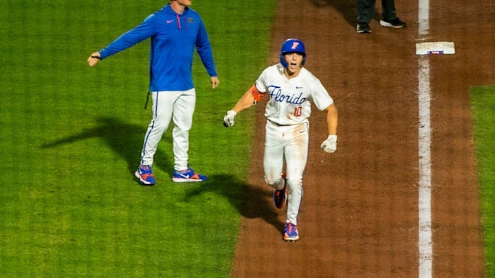 Gators infielder Colby Shelton (10) knocks one out of the ballpark in the bottom of the fifth inning