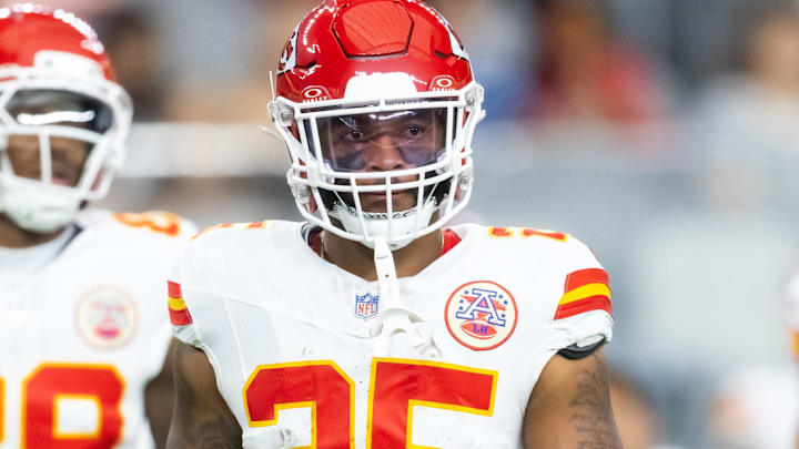Aug 9, 2025; Glendale, Arizona, USA; Kansas City Chiefs running back Elijah Mitchell (25) against the Arizona Cardinals during a preseason NFL game at State Farm Stadium. Mandatory Credit: Mark J. Rebilas-Imagn Images