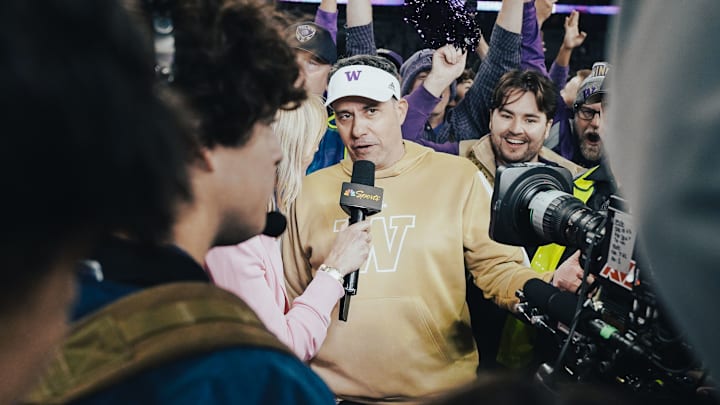 Jedd Fisch likes being in a big crowd, promoting his football team. 