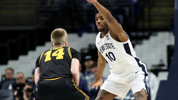Feb 28, 2026; University Park, Pennsylvania, USA; Penn State Nittany Lions forward Josh Reed (10) defends as Iowa Hawkeyes guard Bennett Stirtz (14) holds the ball during the first half at Bryce Jordan Center. Mandatory Credit: Matthew O'Haren-Imagn Images