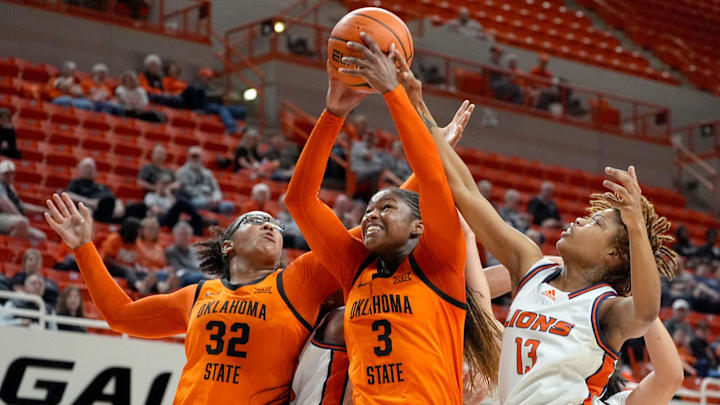 Oklahoma State's Micah Gray (3) and Stailee Heard (32) fight for a rebound from Langston's D'Auzhanay Harden during the college basketball game between the Oklahoma State Cowgirls and the Langston Lions at Gallagher-Iba Arena, Okla., Thursday Nov., 6, 2025.